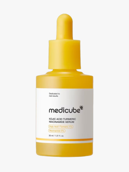 Medicube Kojic Acid Turmeric Serum in branded dropper component on a light gray background